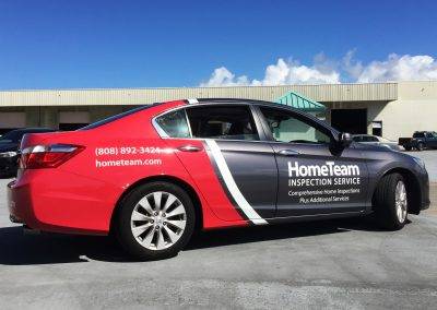 hometeam inspection service car with custom commercial vinyl installed