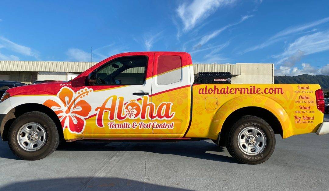 pickup truck with full vinyl wrap featuring business name and graphic