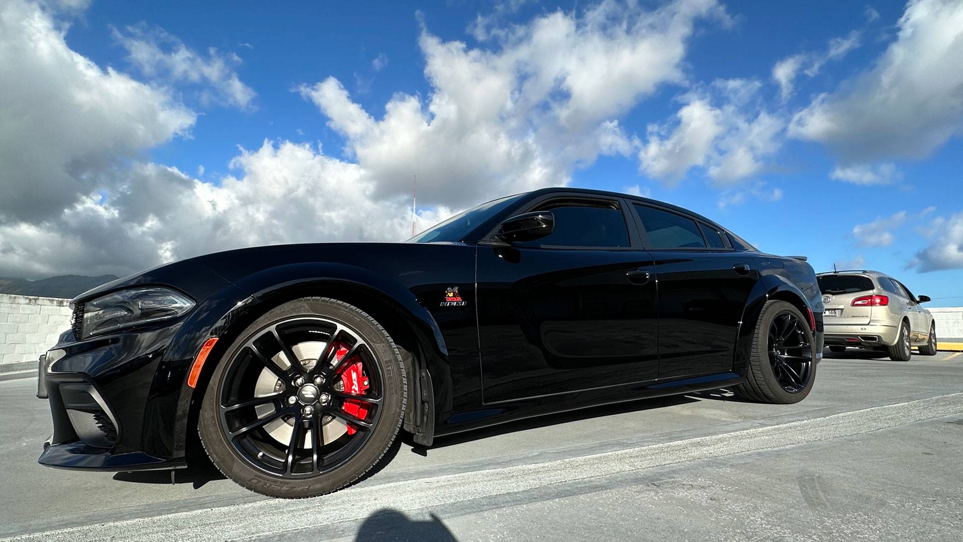 applying paint protection film to the front of a white car